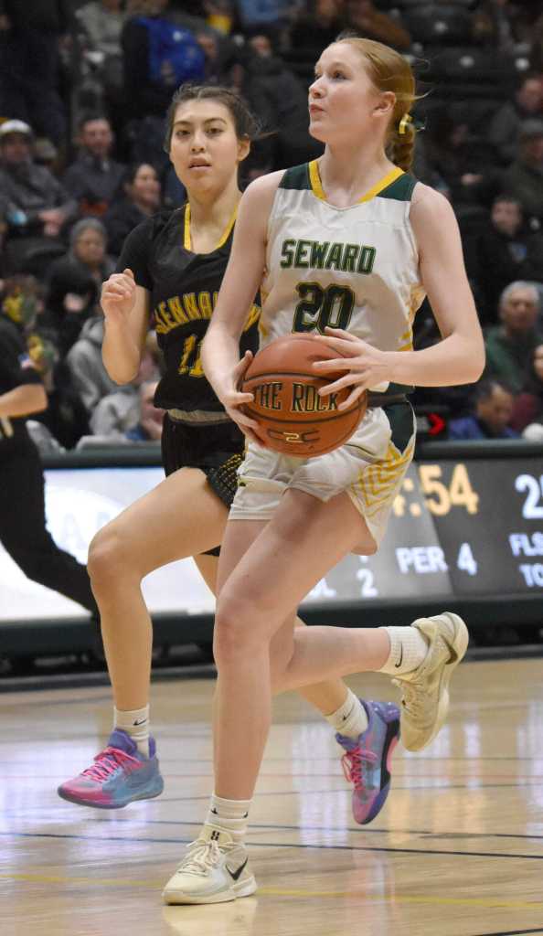 Sewards Grace Fleming drives on Glennallens Cheyenne Fields at the Class 2A girls state championship game Saturday, March 15, 2025, at the Alaska Airlines Center in Anchorage, Alaska. (Photo by Jeff Helminiak/Peninsula Clarion)