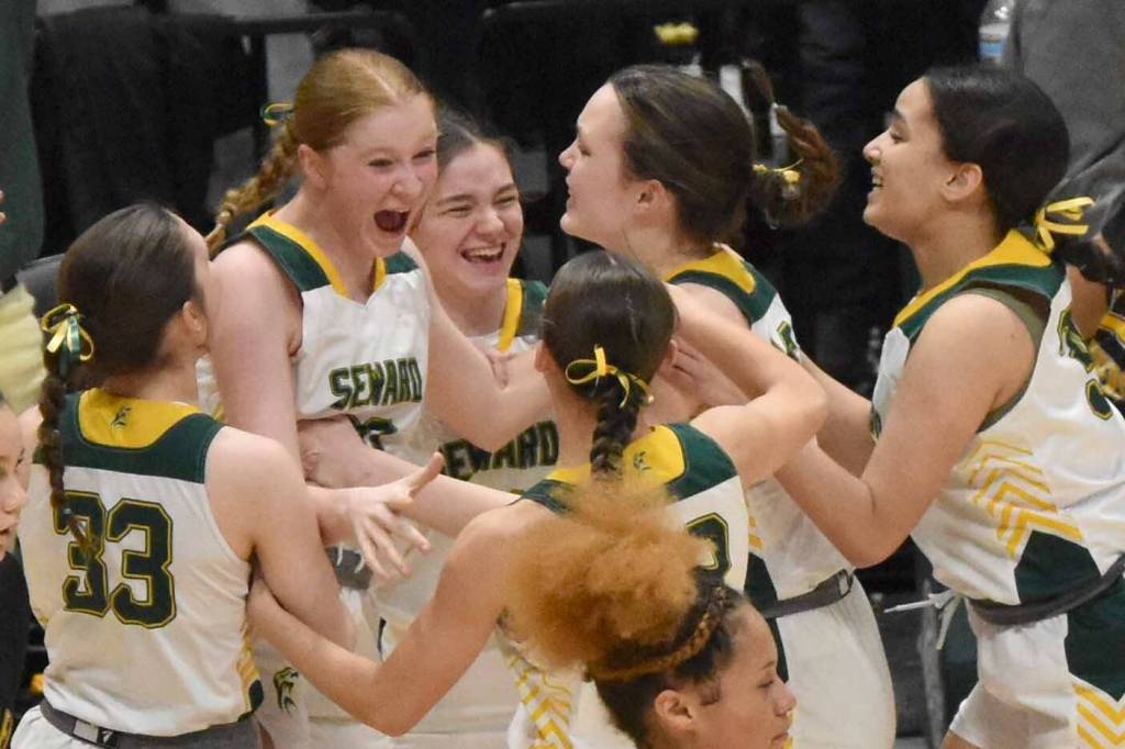 The Seward girls celebrate at the Class 2A girls state championship game Saturday, March 15, 2025, at the Alaska Airlines Center in Anchorage, Alaska. (Photo by Jeff Helminiak/Peninsula Clarion)