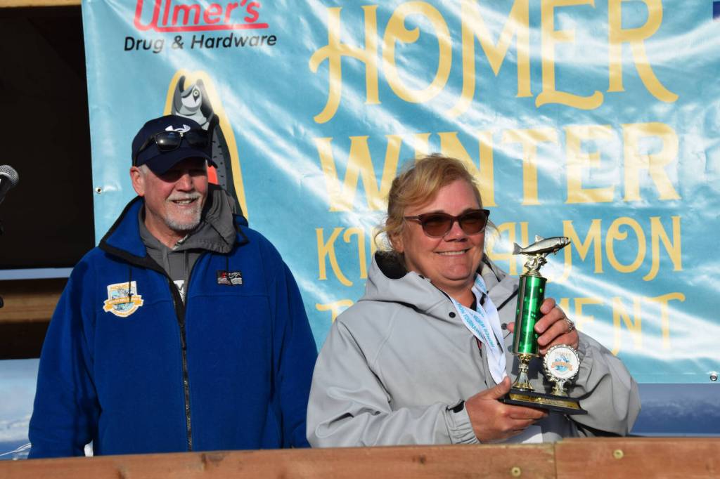 Kim Weimann (right) poses with her third-place trophy during the 2025 Homer Winter King Salmon Tournament on Saturday, March 22, 2025, at the Deep Water Dock on the Homer Spit in Homer, Alaska. (Delcenia Cosman/Homer News)