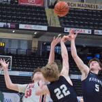 Kenais Mason Tunseth (33) and Homers Henry Wedvik (22) and Benjamin Engebretsen (5) reach for a tipped ball Thursday, March 20, 2025, in their consolation bracket semifinal during the 2025 ASAA March Madness Alaska 3A/4A Basketball State Championships at the Alaska Airlines Center in Anchorage, Alaska. (Klas Stolpe / Juneau Empire)