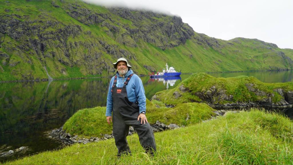 Arctic Coastal Geoscience Lab Director Chris Maio, who is also a contributor to the Pratt Museums Bering Sea Storms: Past to Present exhibit, performs research from the RV Sikuliaq in the Aleutian Islands in Alaska. Photo provided by the Pratt Museum