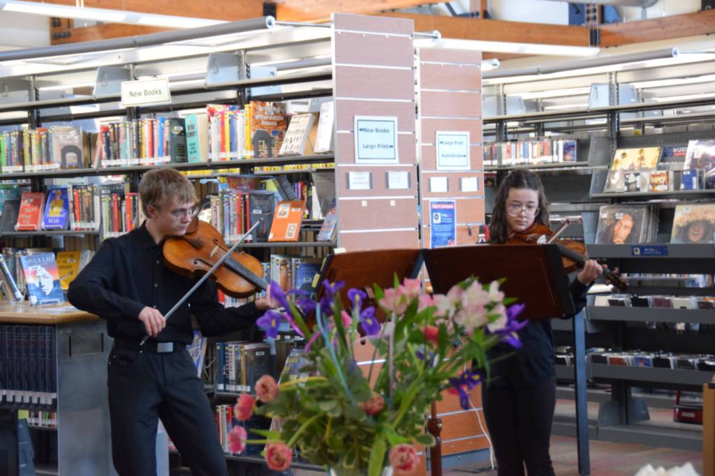 Musicians Daniel Christ and Sophie Williams perform live music during the annual Celebration of Lifelong Learning event at the Homer Public Library on Saturday, March 29, 2025. (Chloe Pleznac/Homer News)