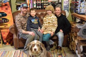 Owners Dahkota Larson and Kait Skundrich sit in a corner of the shop on Friday, March 28, 2025. (Chloe Pleznac/Homer News)