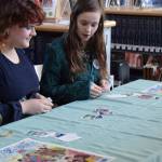 Students play a card game at the center of this years upcoming Summer Reading Program during the annual Celebration of Lifelong Learning event at the Homer Public library on Saturday, March 29, 2025. (Chloe Pleznac/Homer News)