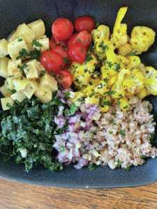 Photo by Tressa Dale/Peninsula Clarion
Sweet potatoes, tomatoes, cauliflower, kale, onions and buckwheat are served in this rich, healthy salad.