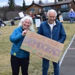 Protesters in Homer hold up a sign during the nationwide Hands Off! protest on Saturday, April 5 at WKFL Park in Homer, Alaska. (Chloe Pleznac/Homer News)