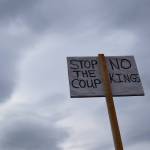 A sign seen during the nationwide Hands Off! protest on Saturday, April 5 at WKFL Park in Homer, Alaska. (Chloe Pleznac/Homer News)