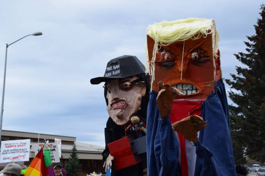 Artist Charles Aguilars puppets arrive at the Hands Off! protest on Saturday, April 5 at WKFL Park in Homer, Alaska. (Chloe Pleznac/Homer News)