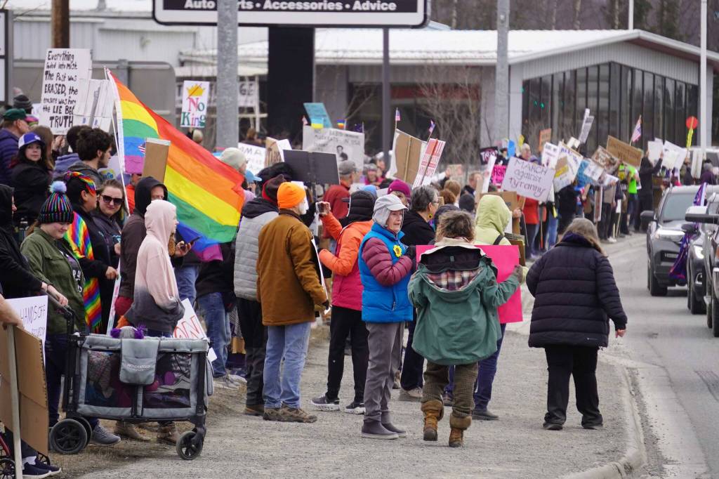 Protesters stand along the Sterling Highway in Soldotna, Alaska, participating in the Remove, Reverse, Reclaim protest organized by Many Voices and Kenai Peninsula Protests as part of the nationwide 50501 effort on Saturday, April 5, 2025. (Jake Dye/Peninsula Clarion)
