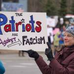 Protesters stand along the Sterling Highway in Soldotna, Alaska, participating in the Remove, Reverse, Reclaim protest organized by Many Voices and Kenai Peninsula Protests as part of the nationwide 50501 effort on Saturday, April 5, 2025. (Jake Dye/Peninsula Clarion)