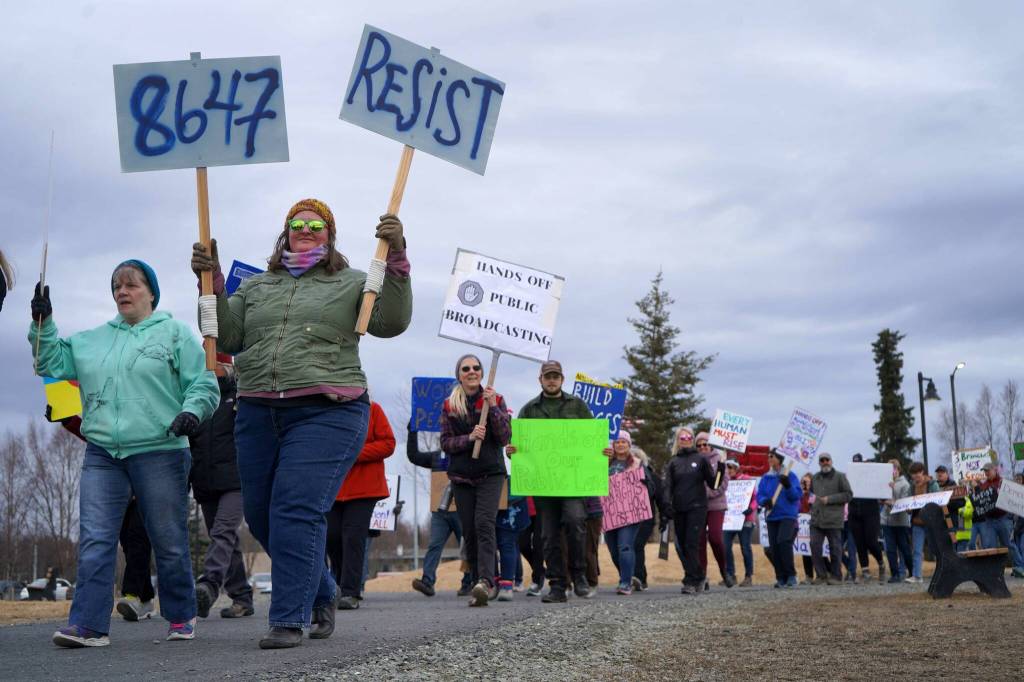 Protesters walk through Soldotna Creek Park in Soldotna, Alaska, participating in the Remove, Reverse, Reclaim protest organized by Many Voices and Kenai Peninsula Protests as part of the nationwide 50501 effort on Saturday, April 5, 2025. (Jake Dye/Peninsula Clarion)