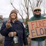 Protesters stand along the Sterling Highway in Soldotna, Alaska, participating in the Remove, Reverse, Reclaim protest organized by Many Voices and Kenai Peninsula Protests as part of the nationwide 50501 effort on Saturday, April 5, 2025. The woman on the left said she was calling for peace in Ukraine. (Jake Dye/Peninsula Clarion)