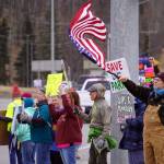 Protesters stand along the Sterling Highway in Soldotna, Alaska, participating in the Remove, Reverse, Reclaim protest organized by Many Voices and Kenai Peninsula Protests as part of the nationwide 50501 effort on Saturday, April 5, 2025. (Jake Dye/Peninsula Clarion)