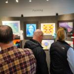 Attendees view the 34th Annual Visual Feast Kenai Peninsula Borough School District Juried Student Art Show during an opening reception at the Kenai Art Center in Kenai, Alaska, on Friday, April 4, 2025. (Jake Dye/Peninsula Clarion)