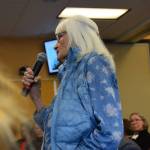 A concerned community member and former educator asks Rep. Sarah Vance a question during her town hall meeting at Kachemak Bay Campus on Saturday, April 12, 2025. Vance attended the meeting remotely from Juneau. (Chloe Pleznac/Homer News)