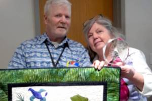 Homer locals Don McNamara and Donna Rae Faulkner of Oceanside Farms pose with their Food Hero Award, presented by the Alaska Food Policy Council. (Photo courtesy of Alaska Food Policy Council)
