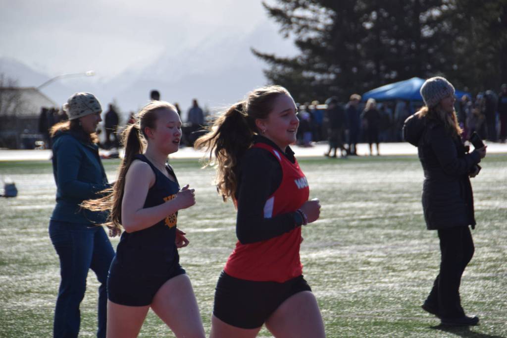 Girls compete in the steeplechase, the first running event of the day on Friday, April 18 at the Homer High School Invitational Track Meet. (Chloe Pleznac/Homer News)