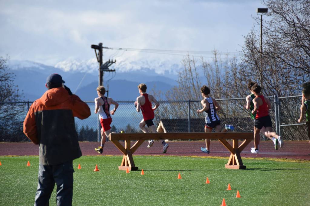A Kenai Kardinal leads the pack during the steeplechase on Friday, April 18 at the Homer High School Invitational Track Meet. (Chloe Pleznac/Homer News)