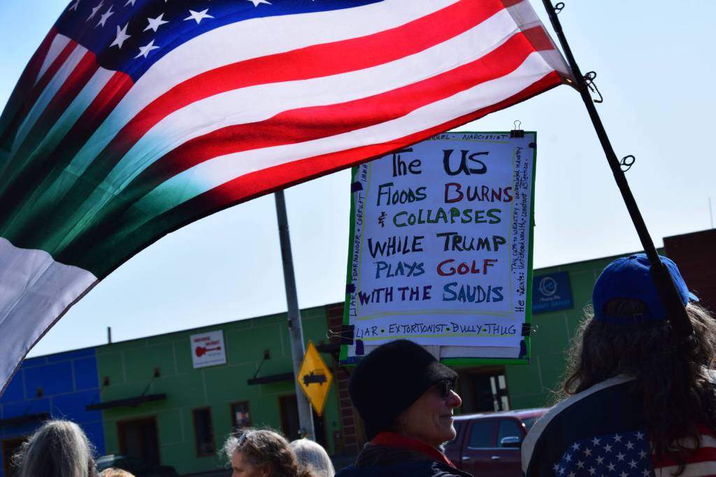 A flag flies on Saturday, April 19 at WKFL Park during the Sustained Resistance, Makes a Difference Rally. (Chloe Pleznac/Homer News)