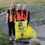 HOWLers pick up trash around town during the annual DiRtBaG Clean-Up Week on Monday, April 21. Since 2011, 900 DiRtBaGs have cleaned up 1720 bags of litter from Homer's trails, beaches, streets and sidewalks. (Chloe Pleznac/Homer News)