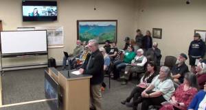 Wild Honey Bistro co-owner Scott Livingston speaks to the Homer City Council on construction planned for Bunnell Avenue and Ohlson Lane in the packed Cowles Council Chambers on Monday, April 14, 2025, in Homer City Hall in Homer, Alaska. Screenshot.