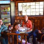 Happy customers pose for a photo in the Fritz Creek General Store on its reopening day on Thursday, April 24. (Chloe Pleznac/Homer News)