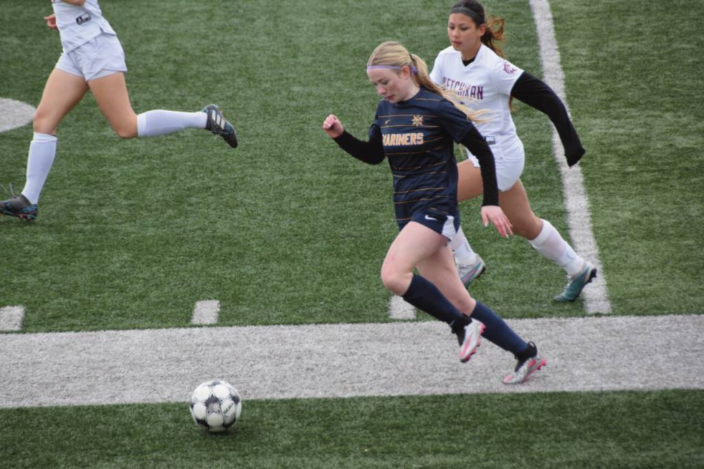A Homer Mariner rushes for the ball during Saturdays soccer game at the Homer High School athletic field on April 26. (Chloe Pleznac/Homer News)