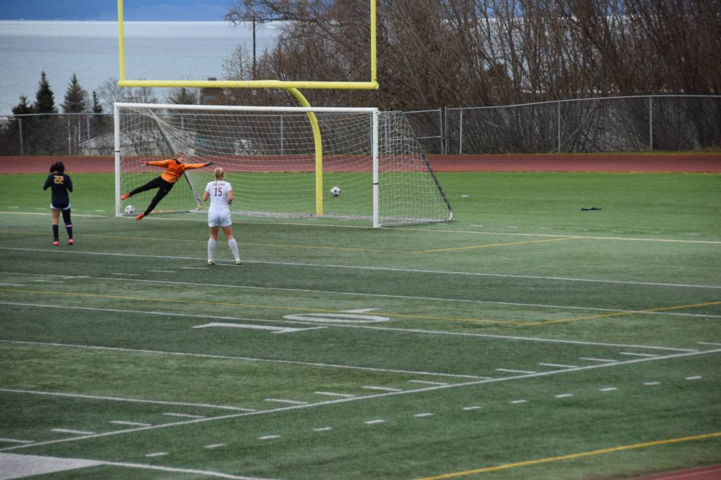 Homers goalie Christi Weisser lunges for the ball as Ketchikan earns their first goal during Saturdays soccer game at the Homer High School athletic field on April 26. (Chloe Pleznac/Homer News)