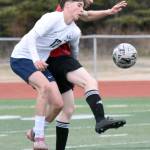 Soldotnas Lane Hillyer and Kenai Centrals Dakota Wisnewski battle for the ball Saturday, April 26, 2025, at Ed Hollier Field at Kenai Central High School in Kenai, Alaska. (Photo by Jeff Helminiak/Peninsula Clarion)