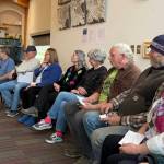 Attendees listen to another person share their thoughts on community-building at the Homer Public Library on Tuesday, April 29. (Chloe Pleznac/Homer News)