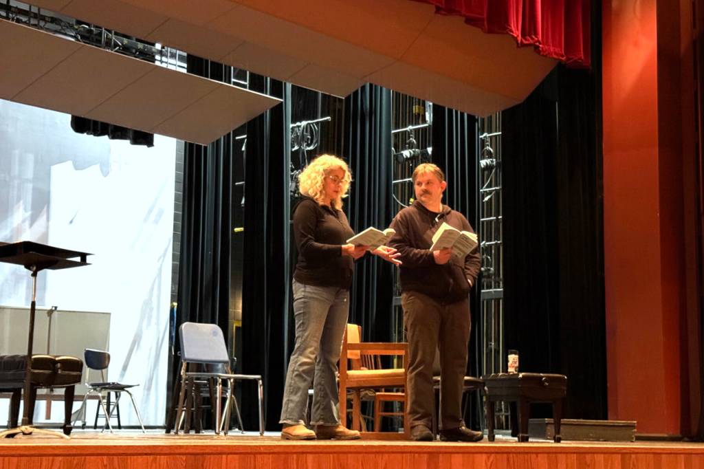 Christine Kulcheski and Tom Custer rehearse for Anton Chekhovs The Seagull on Thursday, May 1, 2025, at the Homer High School Mariner Theater in Homer, Alaska. The play is set to premiere on the Pier One Spit Theatre stage in July. (Chloe Pleznac/Homer News)