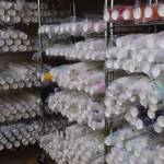 Shelves filled with cups in the Loopy Lupine production facility in Kachemak City on Monday, April 28. (Chloe Pleznac/Homer News)