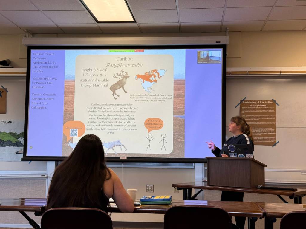 Nyla Klein displays a digital poster she created for her final practicum on Thursday, May 1, 2025, at Kachemak Bay Campus, in Homer, Alaska. (Chloe Pleznac/Homer News)