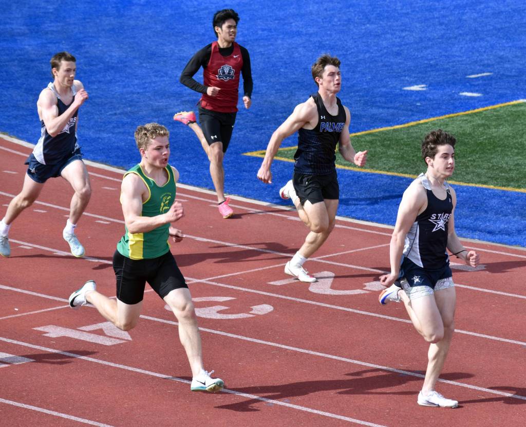 Soldotnas Tyce Escott leads Sewards Ronan Bickling and the rest of the 200-meter dash field at the SoHi Invite on Saturday, May 3, 2025, at Soldotna High School in Soldotna, Alaska. (Photo by Jeff Helminiak/Peninsula Clarion)