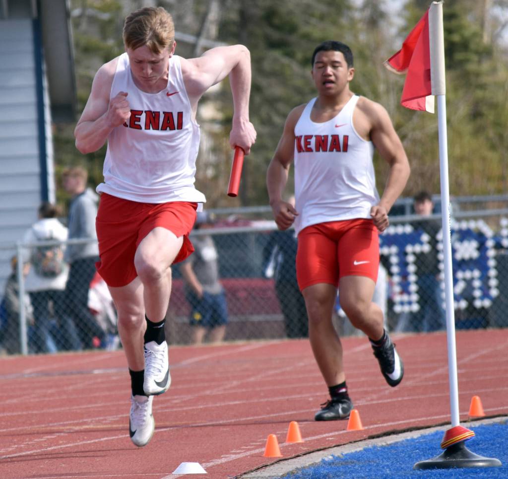 Kenai Centrals Elliot Hanson takes the baton from Delen Byrd at the SoHi Invite on Saturday, May 3, 2025, at Soldotna High School in Soldotna, Alaska. (Photo by Jeff Helminiak/Peninsula Clarion)