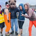 Community members and SPH staff pose with Beary the Be Well Bear during the 2024 Safe and Healthy Kids Fair in the Homer High School parking lot. (Photo courtesy of South Peninsula Hospital)