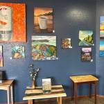 Paintings by Ashley Story, photographed on May 10, 2025, are on display at the Art Shop Gallery in Homer, Alaska, for the month of May. Photo by Christina Whiting