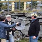 Ethno-ornithologist and festival keynote speaker Dr. Ben Mirin (left) walks teaching assistant Jim Herbert (center) and another workshop participant through using a parabola microphone to capture audio of birds and other nature sounds during his wildlife sound recording session during the 2025 Shorebird Festival on Friday, May 9, 2025, at the Alaska Maritime National Wildlife Refuge Visitor Center in Homer, Alaska. (Delcenia Cosman/Homer News)