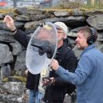 Shorebird Festival attendees use a parabola microphone to capture audio of birds and other nature sounds during keynote speaker Dr. Ben Mirins wildlife sound recording session on Friday, May 9, 2025, at the Alaska Maritime National Wildlife Refuge Visitor Center in Homer, Alaska. (Delcenia Cosman/Homer News)