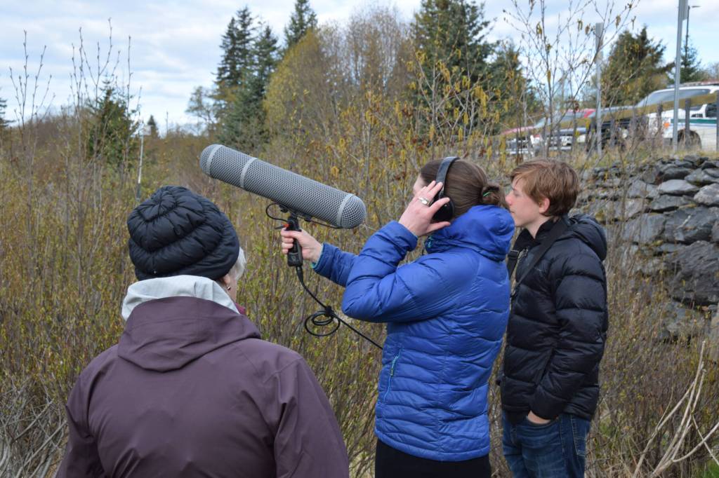 Shorebird Festival attendees use a shotgun microphone to capture audio of birds and other nature sounds during keynote speaker Dr. Ben Mirins wildlife sound recording session on Friday, May 9, 2025, at the Alaska Maritime National Wildlife Refuge Visitor Center in Homer, Alaska. (Delcenia Cosman/Homer News)
