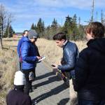 Shorebird Festival keynote speaker Dr. Ben Mirin (center) explains to workshop participants how to take annotated recordings of nature during his wildlife sound recording session on Friday, May 9, 2025, at the Alaska Maritime National Wildlife Refuge Visitor Center in Homer, Alaska. (Delcenia Cosman/Homer News)