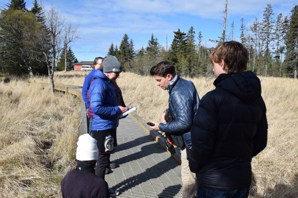 Shorebird Festival keynote speaker Dr. Ben Mirin (center) explains to workshop participants how to take annotated recordings of nature during his wildlife sound recording session on Friday, May 9, 2025, at the Alaska Maritime National Wildlife Refuge Visitor Center in Homer, Alaska. (Delcenia Cosman/Homer News)