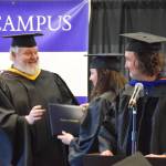 Dr. Jeff Johnson (right), Professor of Mathematics, and campus director Brian Partridge (left) present Emily Sloth (center) with her medical assisting certificate at the 55th annual commencement ceremony on Wednesday, May 7, 2025, at Kachemak Bay Campus in Homer, Alaska. (Delcenia Cosman/Homer News)