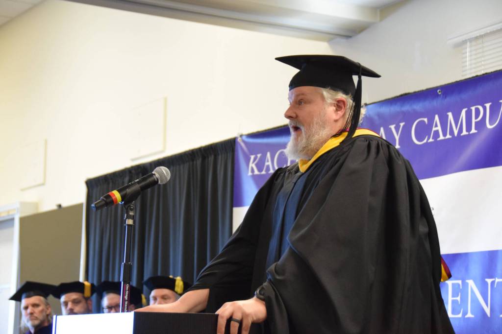 Kachemak Bay Campus director Brian Partridge addresses graduates and their friends and families gathered in the audience at the 55th annual commencement ceremony on Wednesday, May 7, 2025, at Kachemak Bay Campus in Homer, Alaska. (Delcenia Cosman/Homer News)
