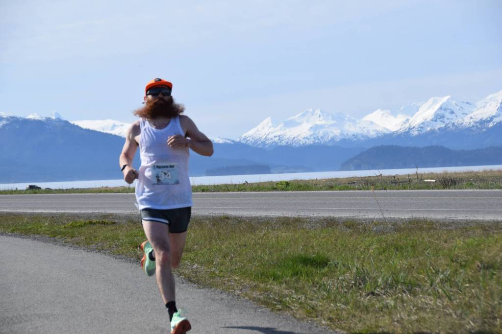Homers Alec Mclaughlin closes in on the 2025 Migration Run finish line on Mothers Day, Sunday, May 11 on the Homer Spit in Homer, Alaska. He finished second for the men, with a time of 18:07.47. (Chloe Pleznac/Homer News)