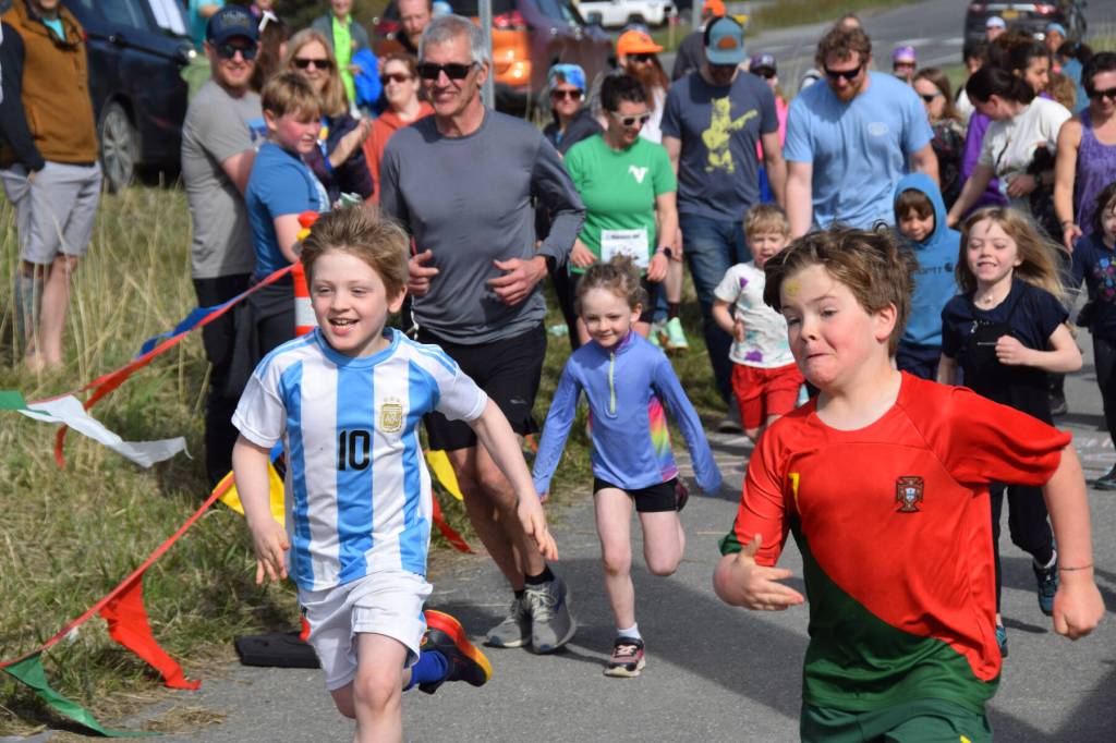 Youth set off from the starting line during the newly introduced kids one miler on Mothers Day, Sunday, May 11 on the Homer Spit in Homer, Alaska. (Chloe Pleznac/Homer News)