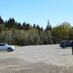 Cars of parkgoers sit in the expanded Jack Gist Park parking lot on Tuesday, May 13, 2025 in Homer, Alaska. (Chloe Pleznac/Homer News)