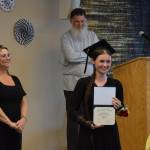 Susana Martushev holds up her diploma during the Voznesenka School commencement ceremony held Monday, May 19, 2025, at Lands End Resort in Homer, Alaska. (Delcenia Cosman/Homer News)
