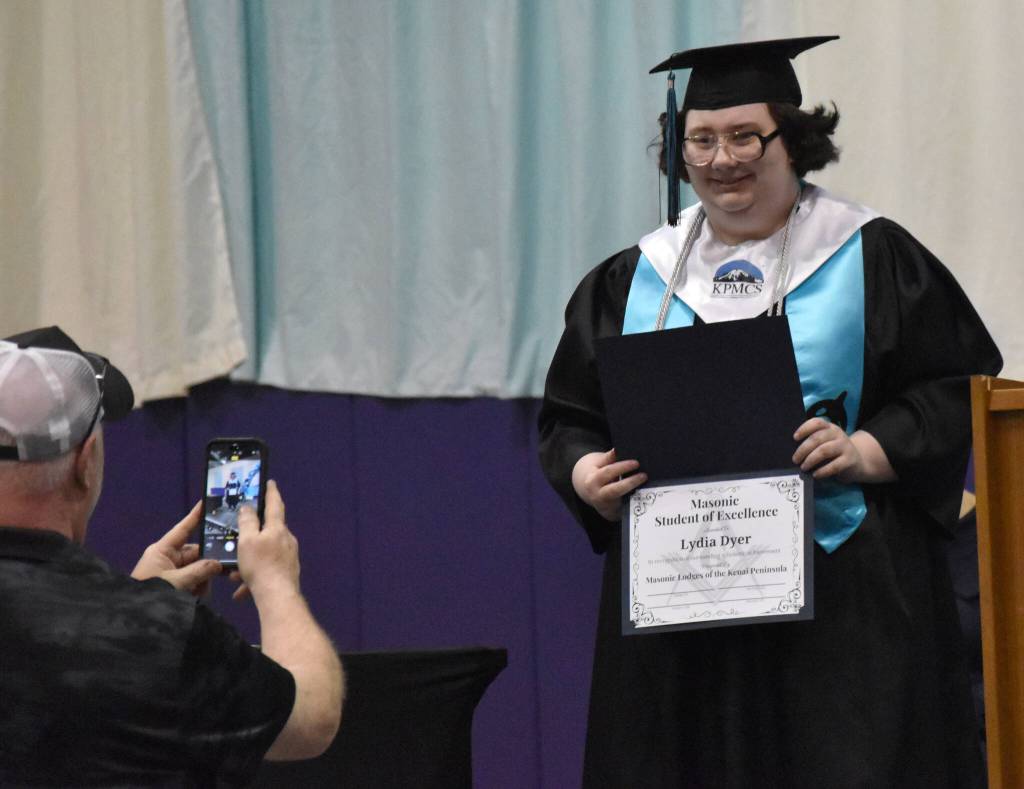 Lydia Dyer accepts the Masonic Student of Excellence award at the River City Academy graduation ceremony Tuesday, May 20, 2025, at Skyview Middle School just outside of Soldotna, Alaska. (Photo by Jeff Helminiak/Peninsula Clarion)