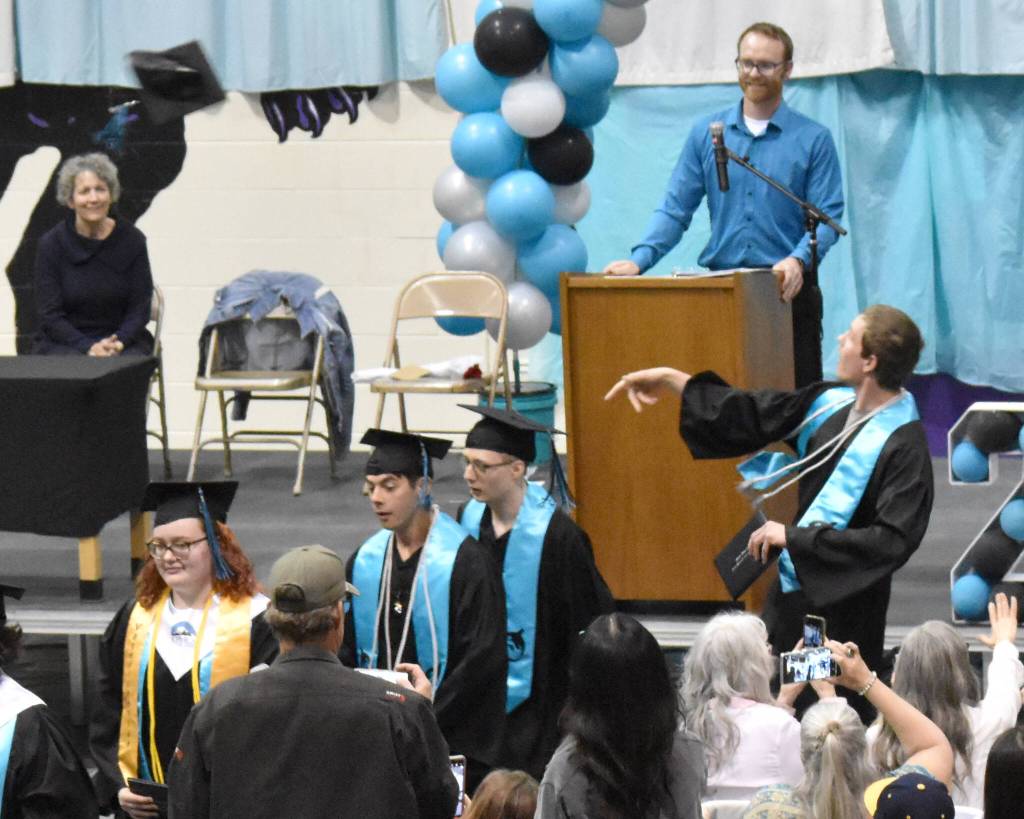 Nicholaus Benkendorf tosses his mortarboard at the River City Academy graduation ceremony Tuesday, May 20, 2025, at Skyview Middle School just outside of Soldotna, Alaska. (Photo by Jeff Helminiak/Peninsula Clarion)
